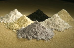 Samples of rare earth oxide powders in dishes