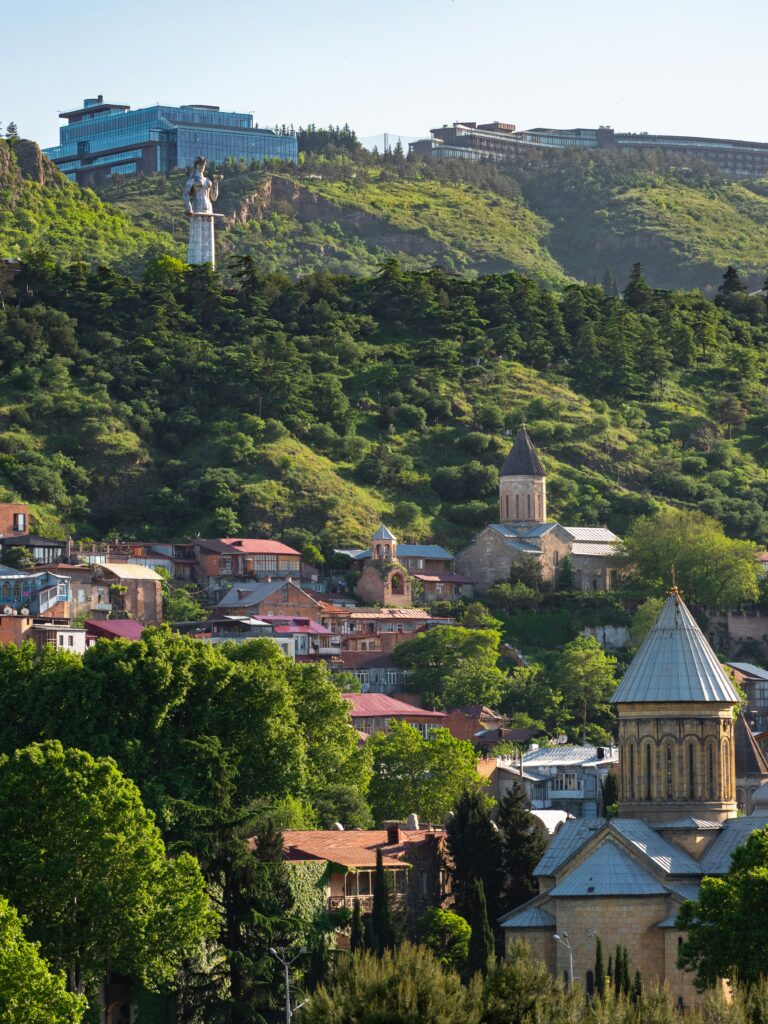 Tbilisi cityscape with historic churches and modern buildings
