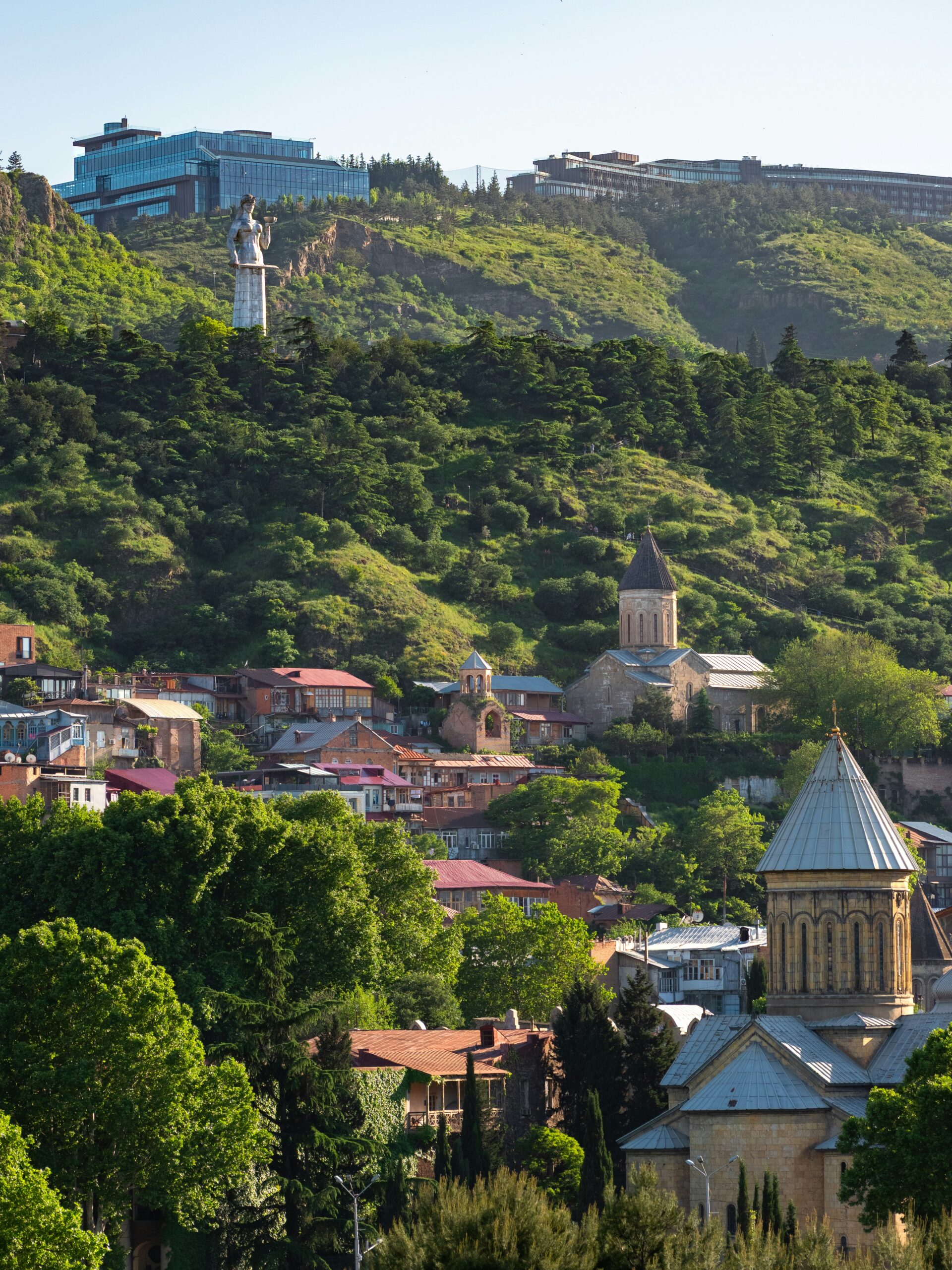 Tbilisi cityscape with historic churches and modern buildings