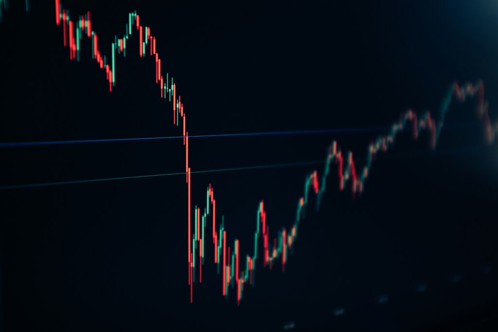 Candlestick stock chart on a dark screen