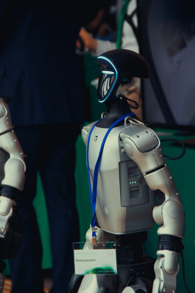 Humanoid robot wearing a lanyard and badge