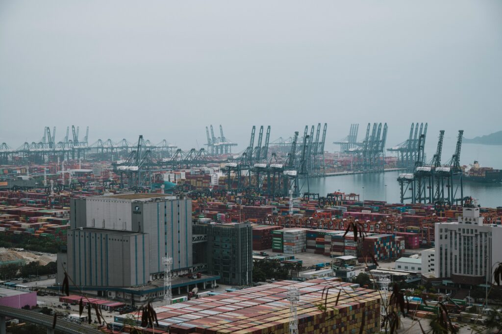 Container ship terminal with stacked shipping containers